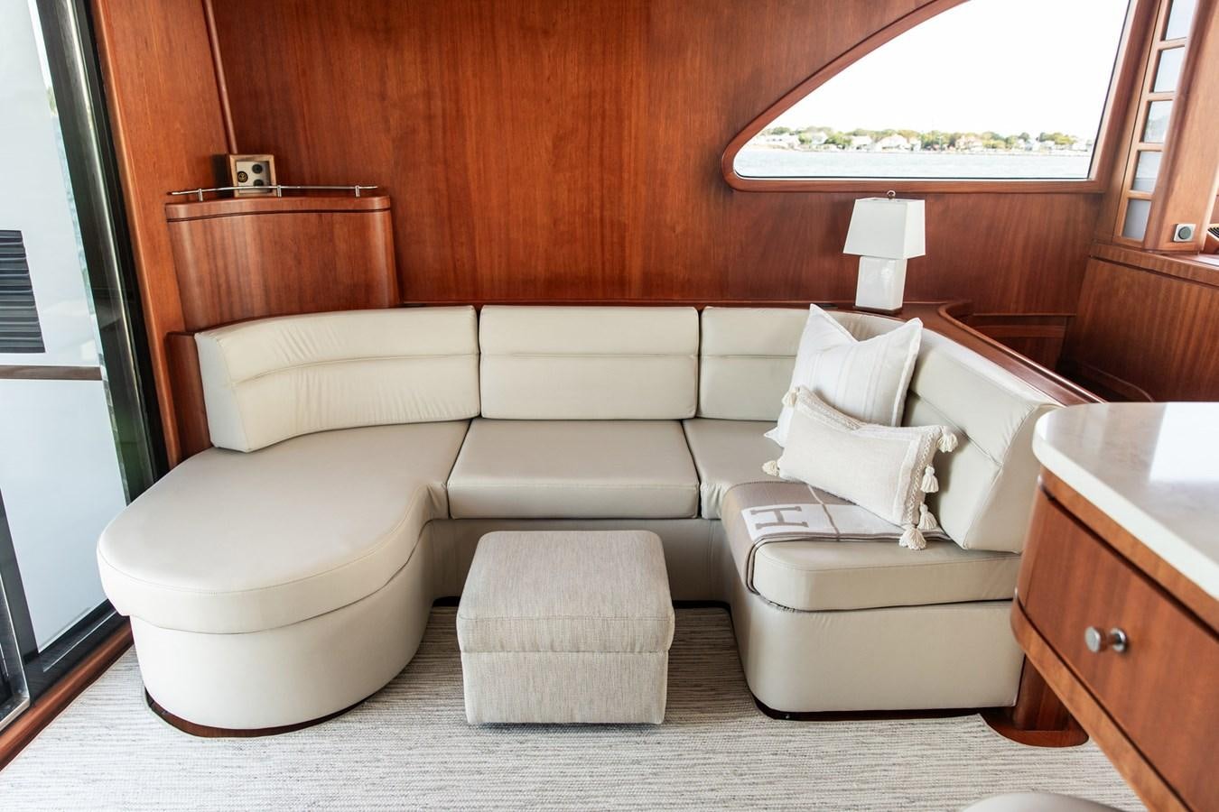 a room with a bed and a desk aboard ARAGOSTA Yacht for Sale