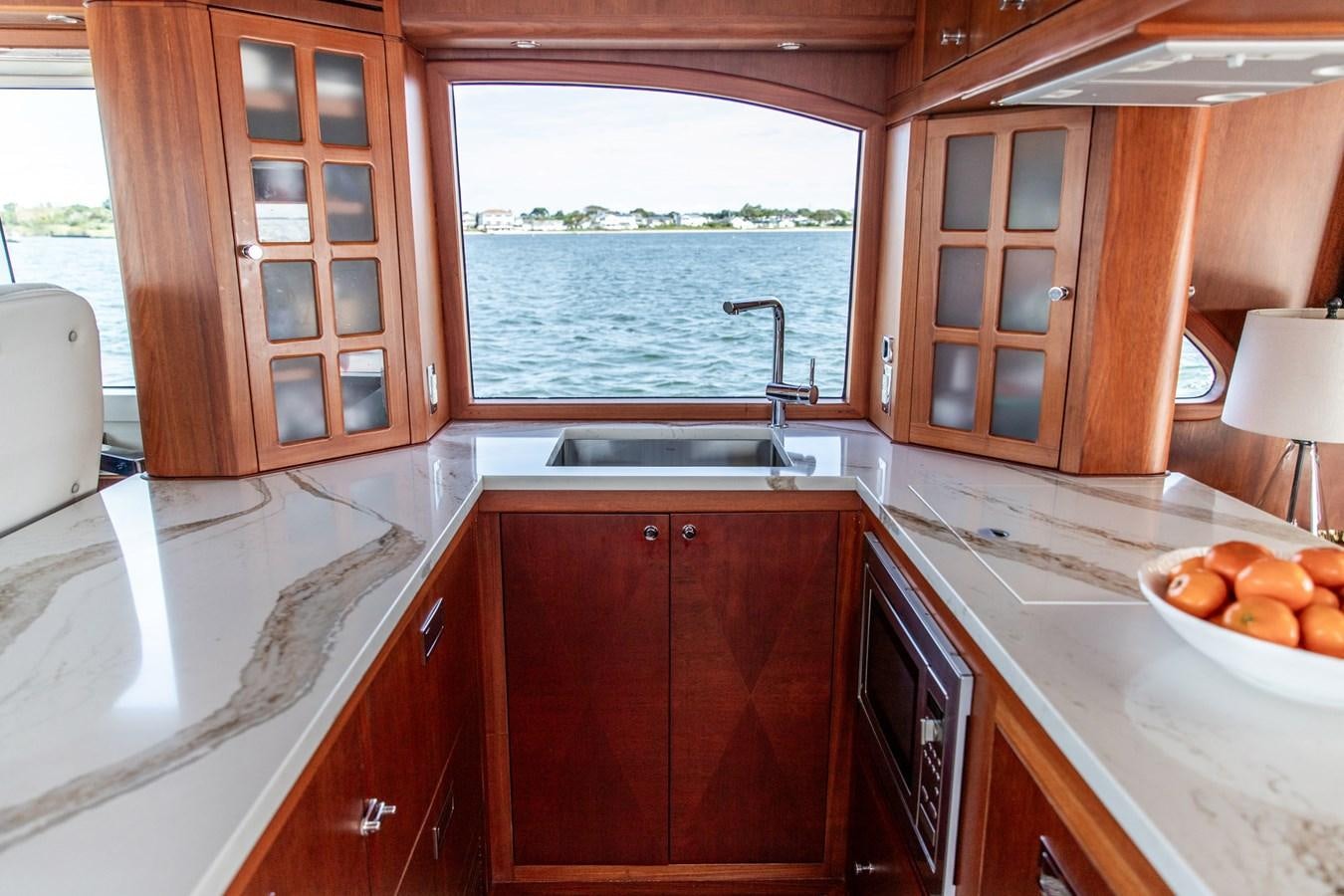 a kitchen with a sink and cabinets aboard ARAGOSTA Yacht for Sale