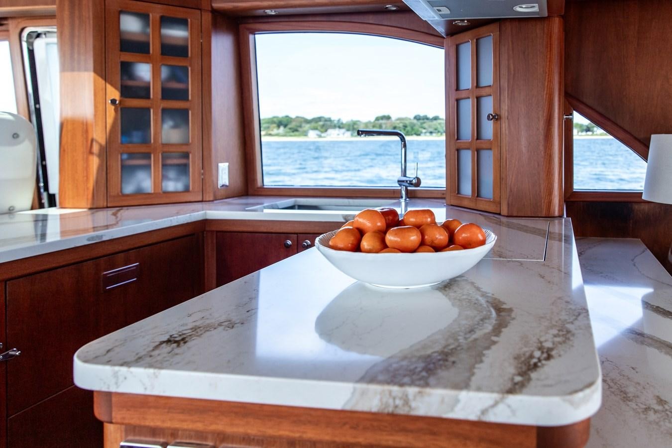 a bowl of oranges on a counter top aboard ARAGOSTA Yacht for Sale