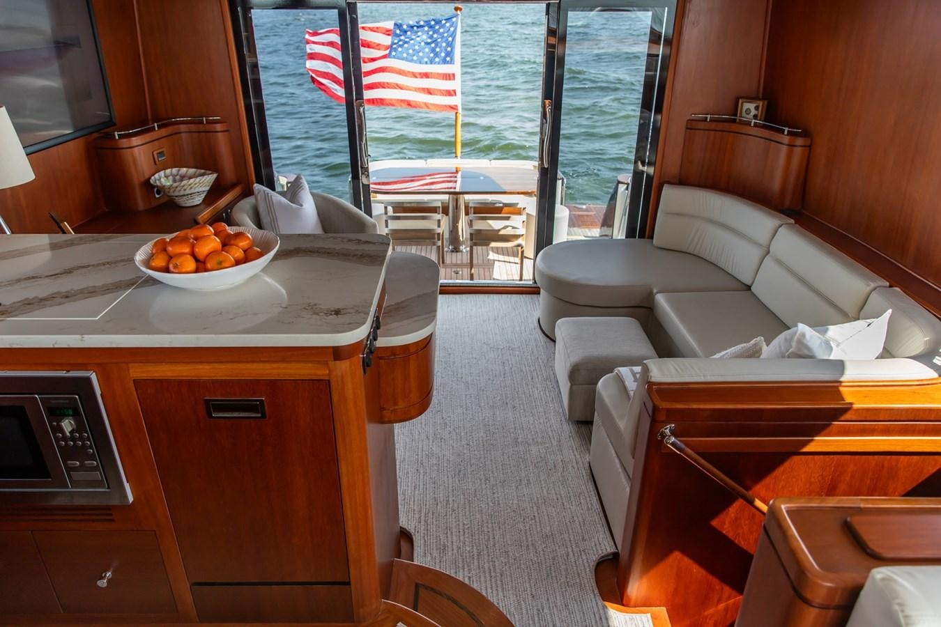a room with a table and chairs aboard ARAGOSTA Yacht for Sale