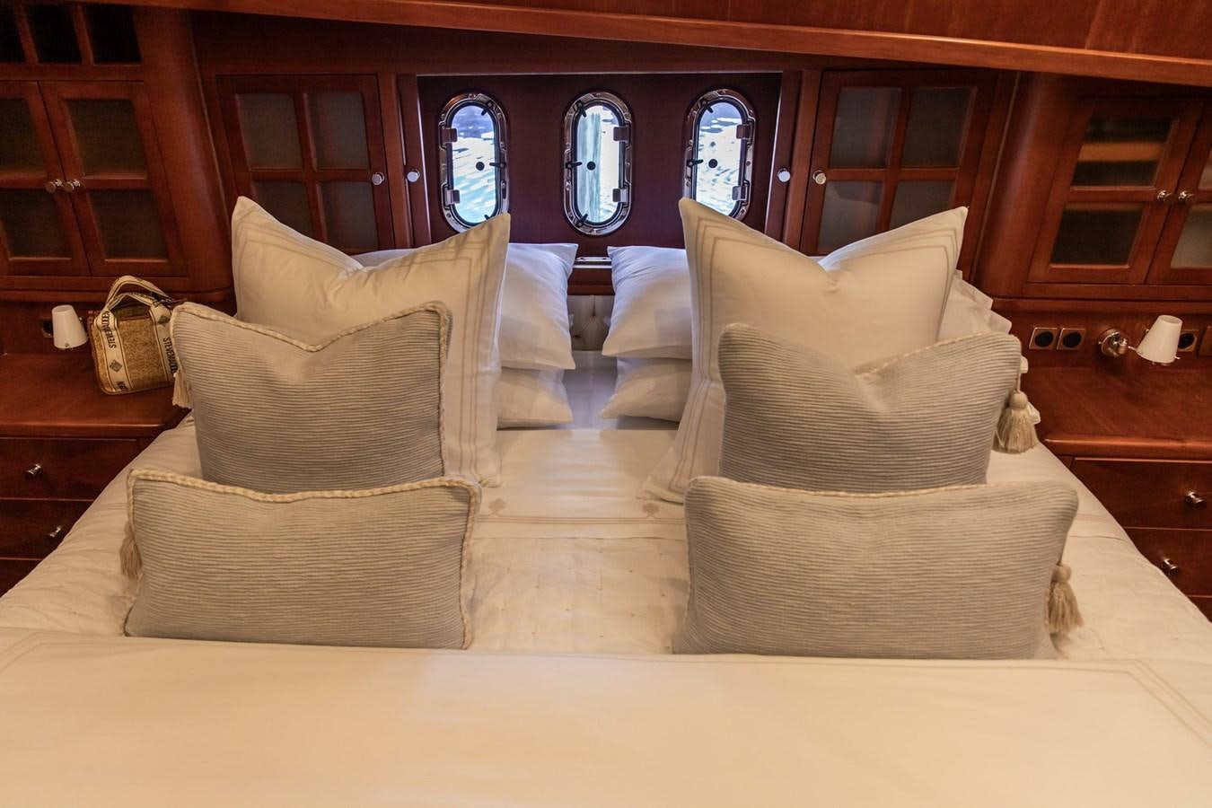 a bed with pillows aboard ARAGOSTA Yacht for Sale