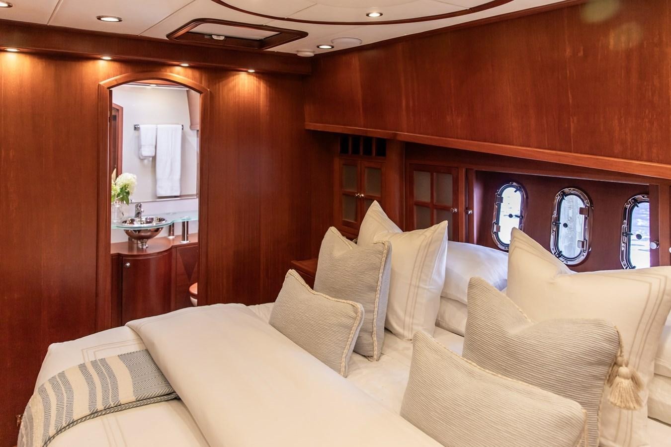 a room with couches and a mirror aboard ARAGOSTA Yacht for Sale