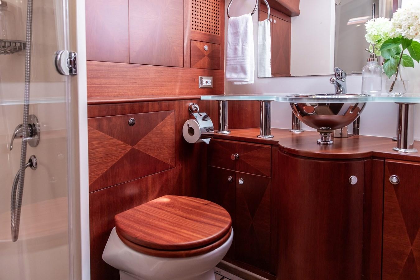 a bathroom with a toilet and sink aboard ARAGOSTA Yacht for Sale