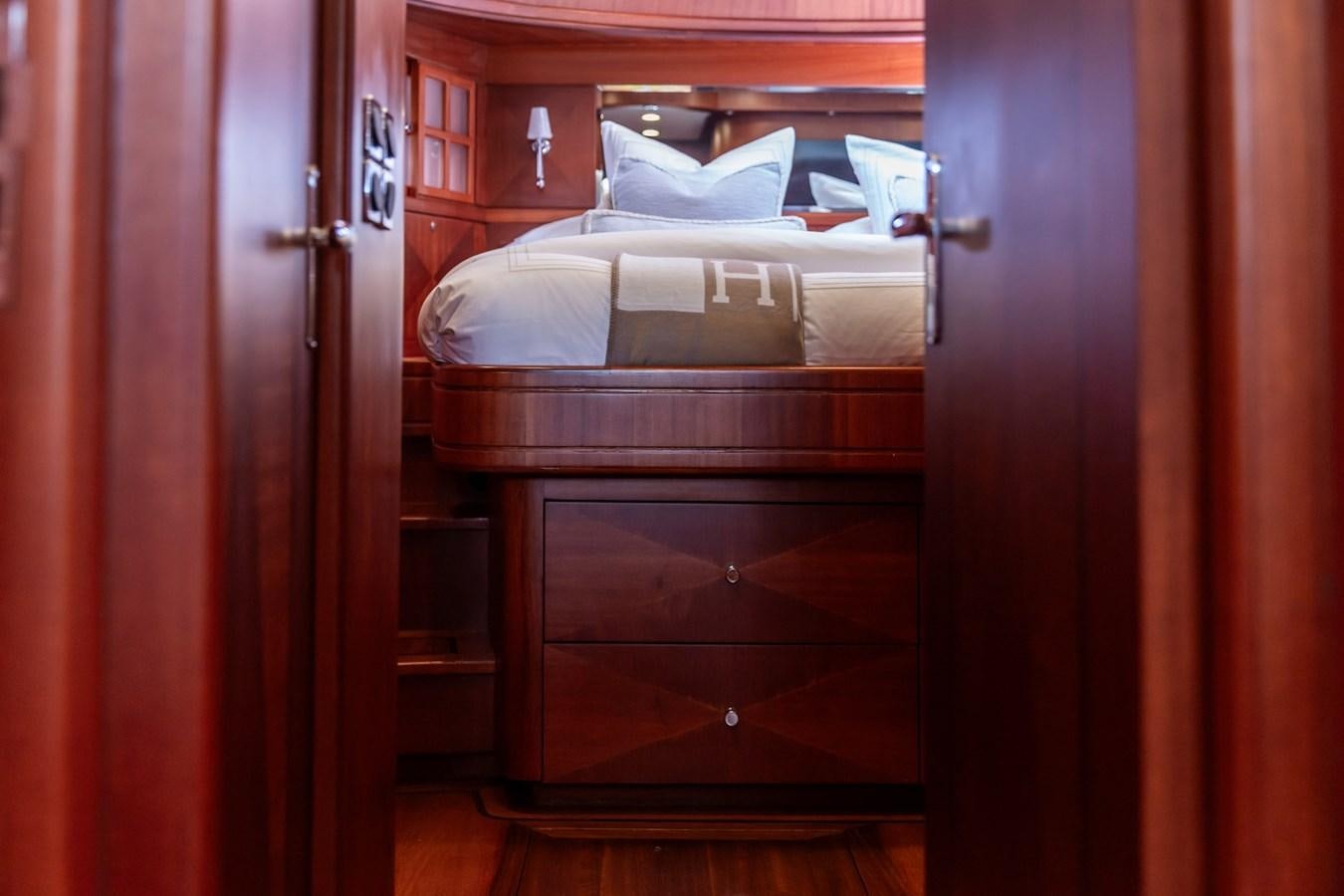 a room with a bed and a couch aboard ARAGOSTA Yacht for Sale