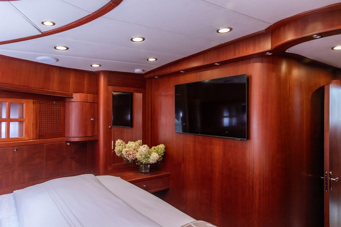 a room with a bed and a television aboard ARAGOSTA Yacht for Sale