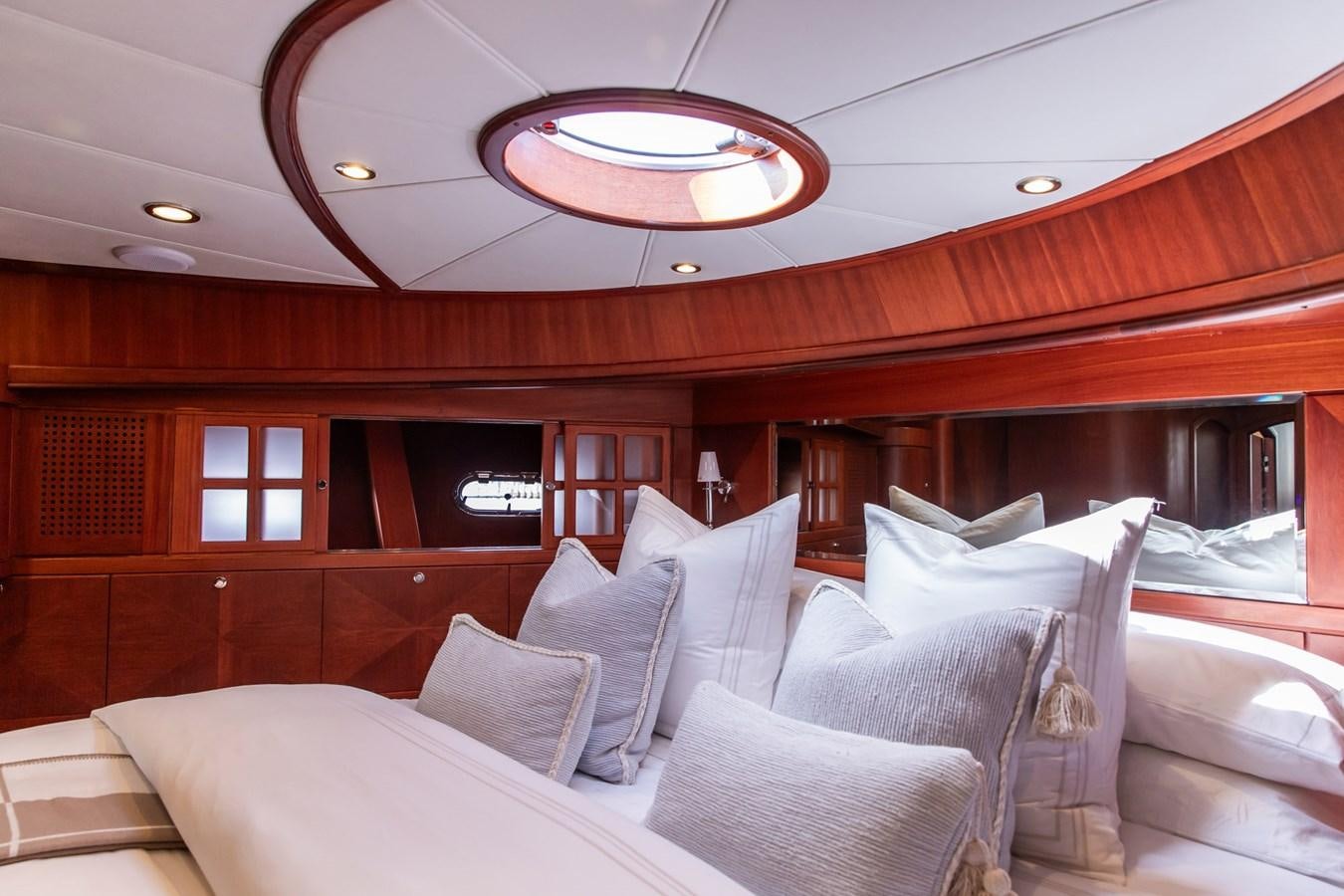 a room with a bed and a ceiling fan aboard ARAGOSTA Yacht for Sale