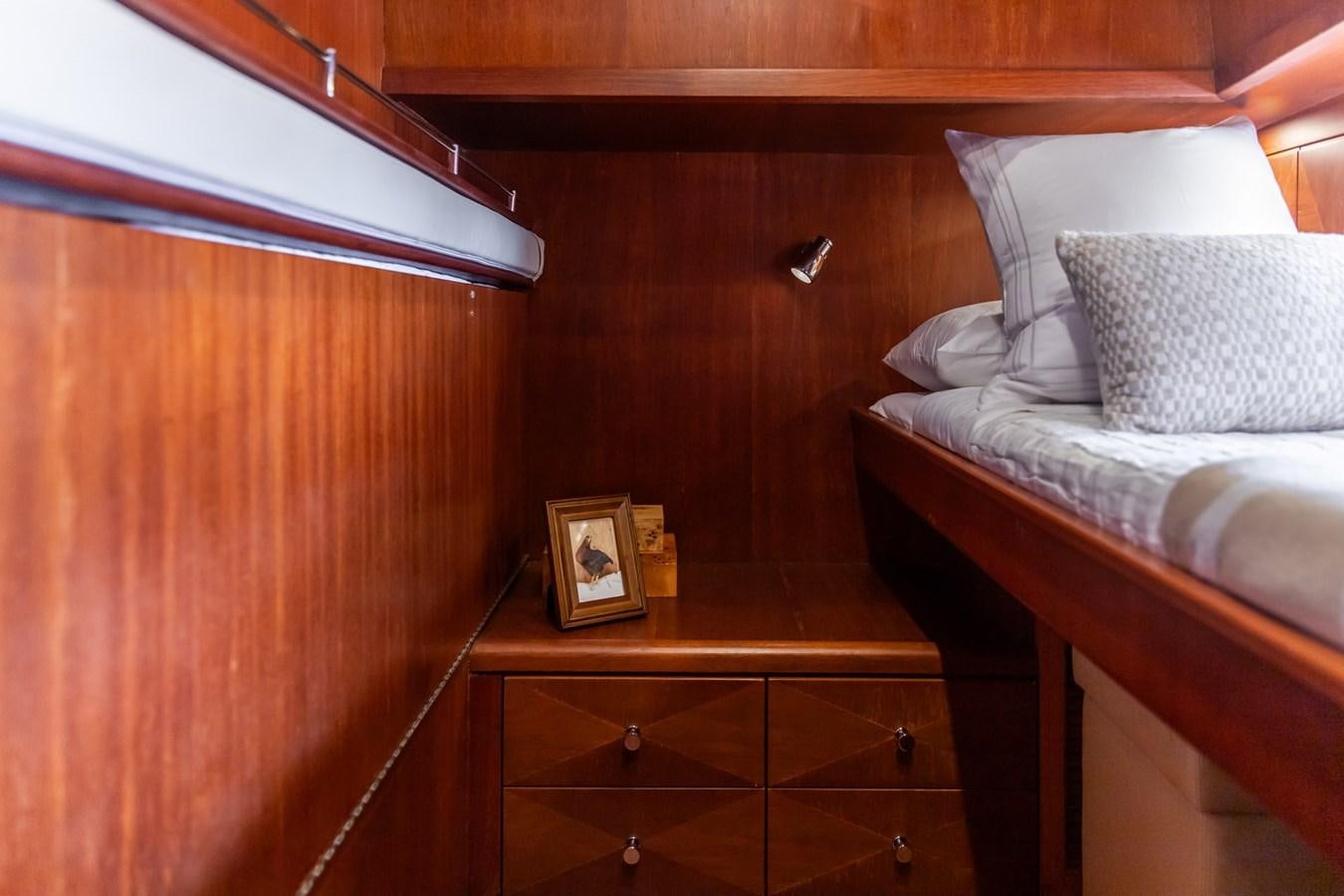 a bed with a picture on it aboard ARAGOSTA Yacht for Sale