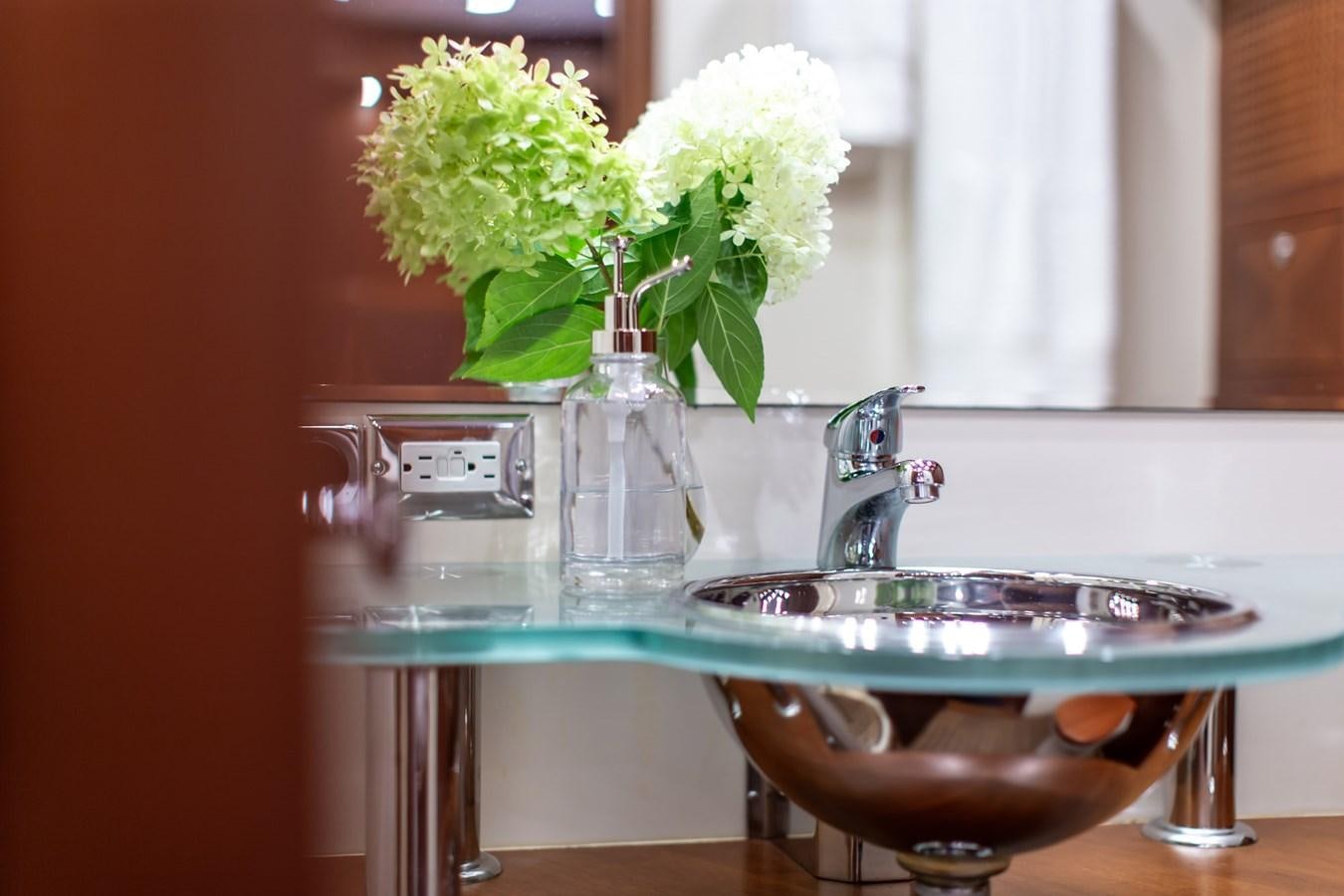a sink with flowers in it aboard ARAGOSTA Yacht for Sale