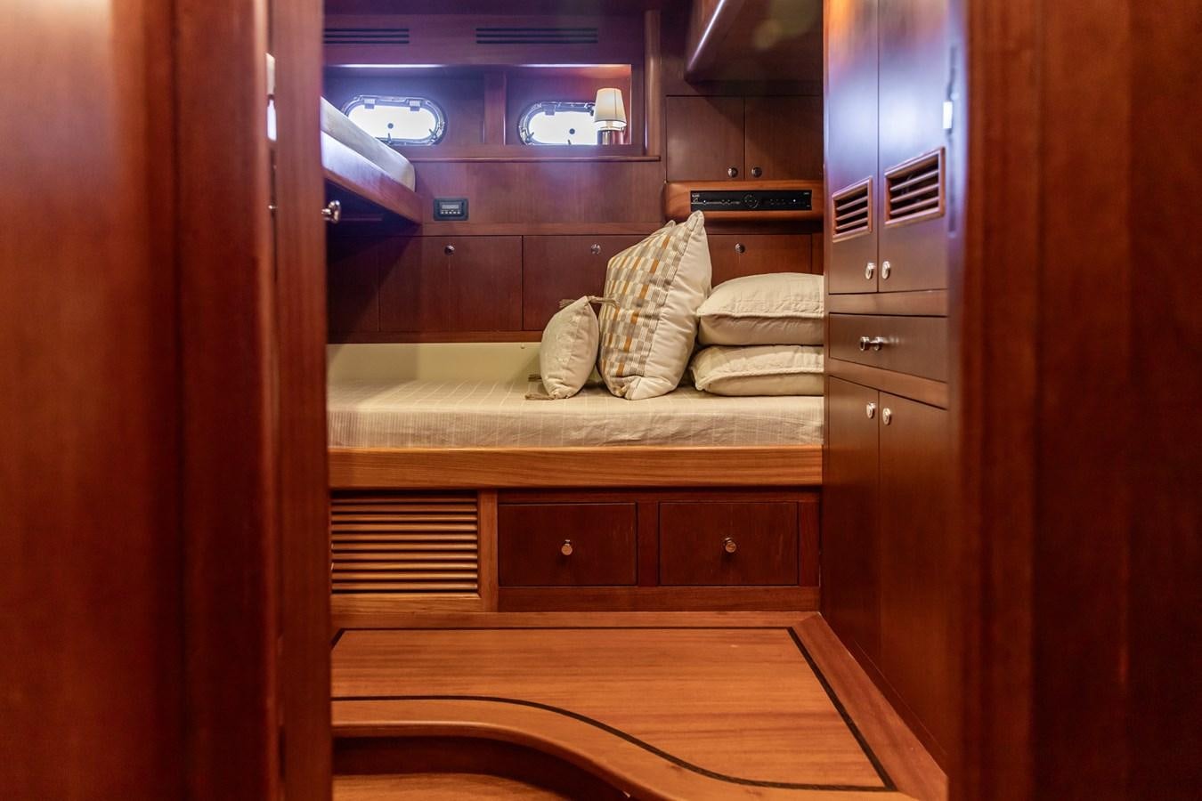 a bed in a room aboard ARAGOSTA Yacht for Sale