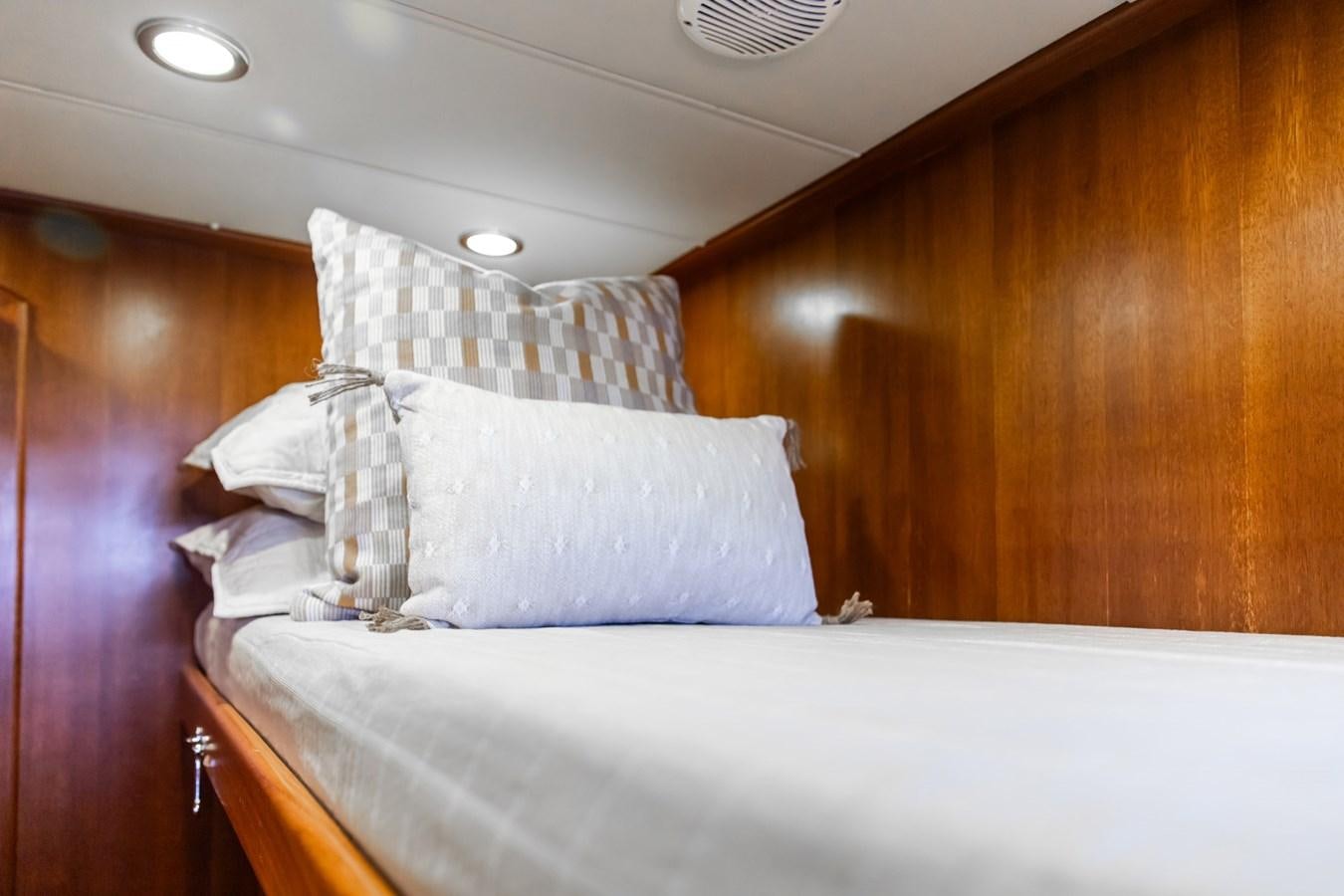 a bed with white sheets aboard ARAGOSTA Yacht for Sale
