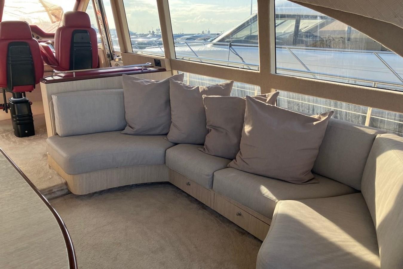 a couch with pillows aboard VINTAGE Yacht for Sale