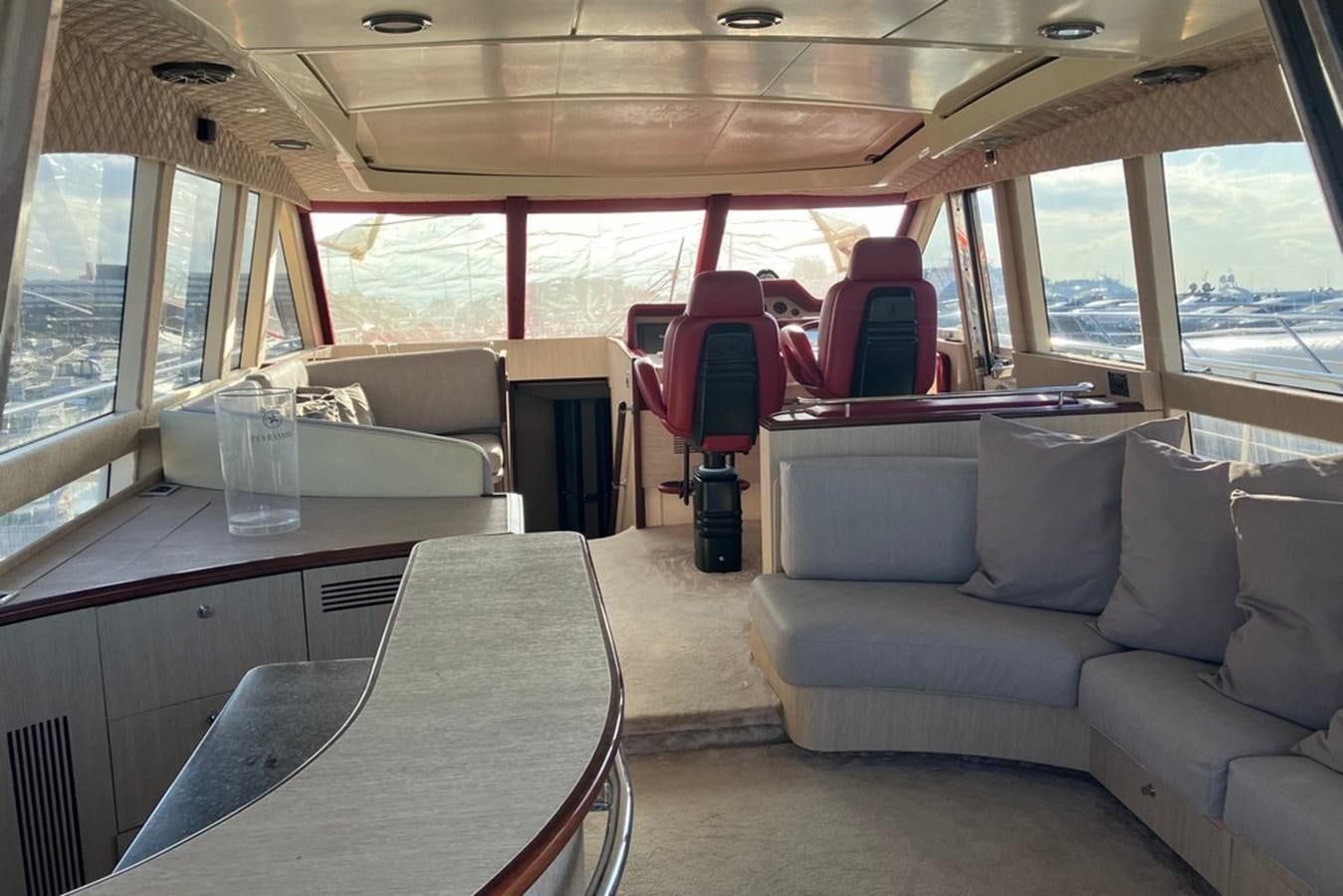 a vehicle with a table and chairs aboard VINTAGE Yacht for Sale