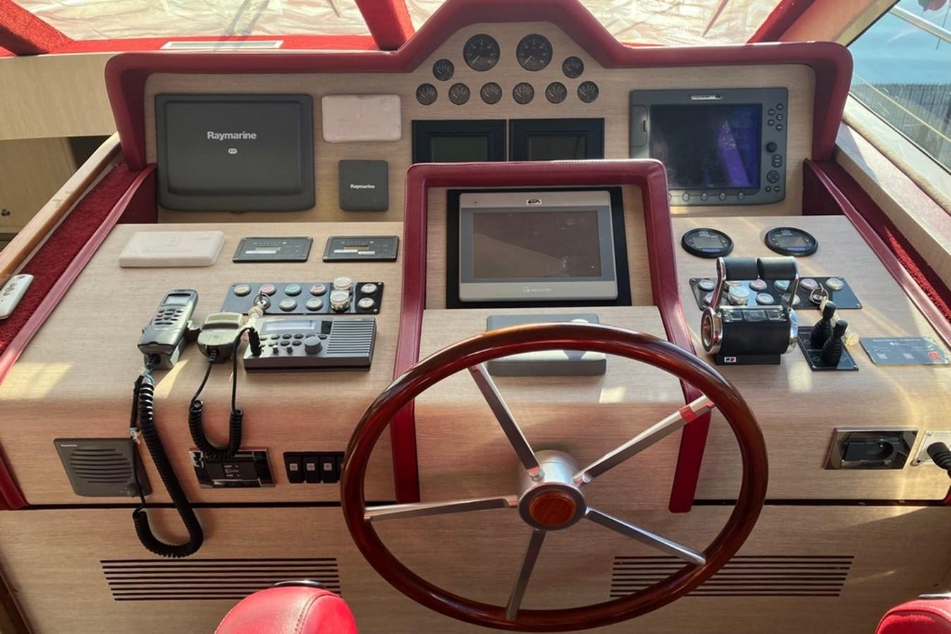 a red and black electronic device aboard VINTAGE Yacht for Sale