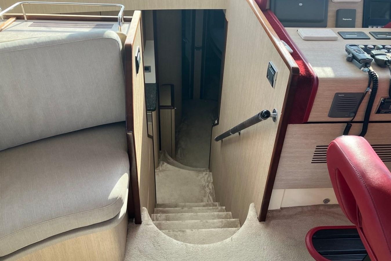 a staircase with a metal railing aboard VINTAGE Yacht for Sale