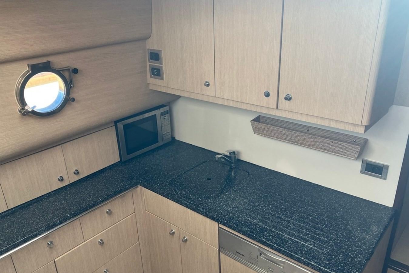 a kitchen with a marble counter top aboard VINTAGE Yacht for Sale