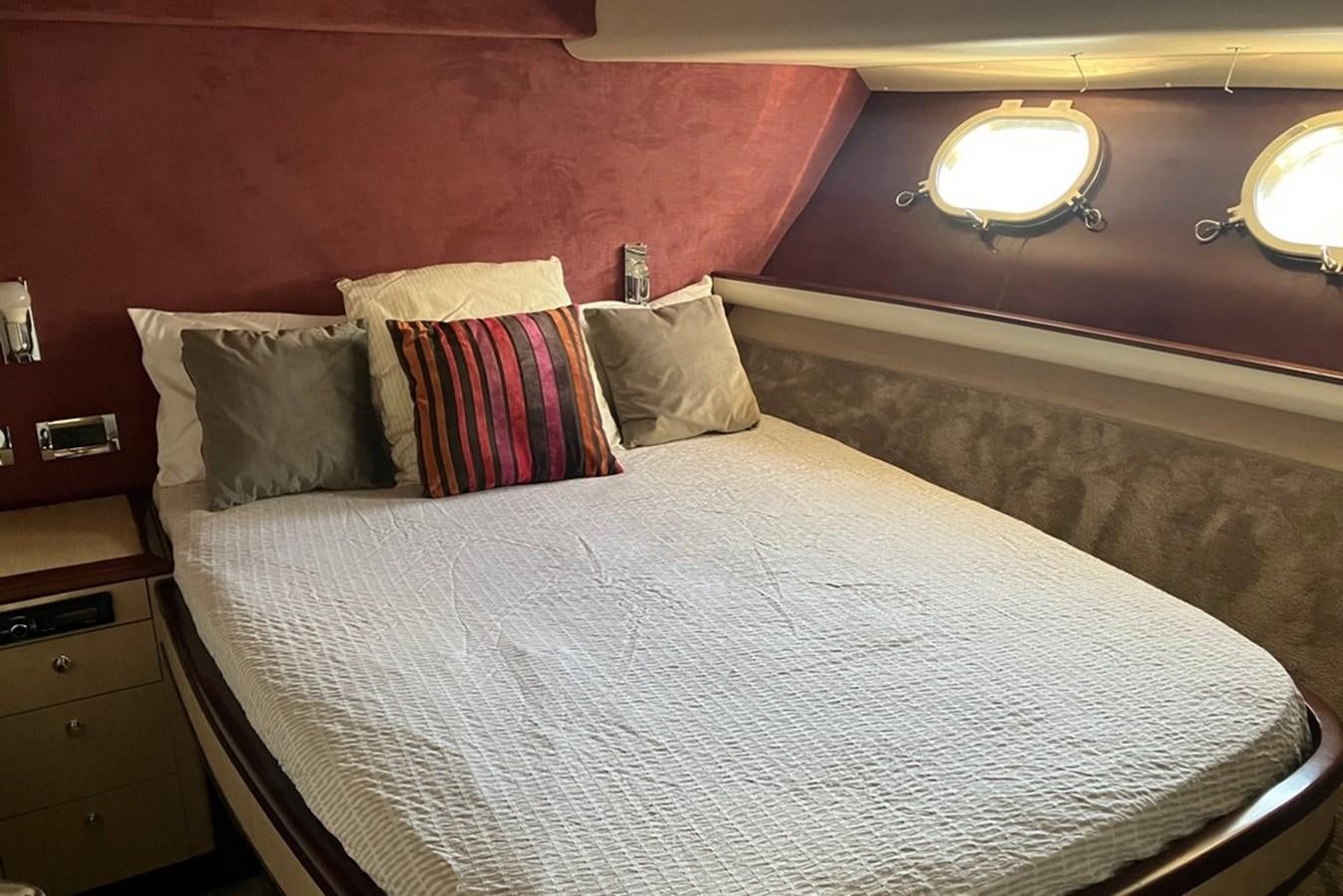 a bed with pillows aboard VINTAGE Yacht for Sale