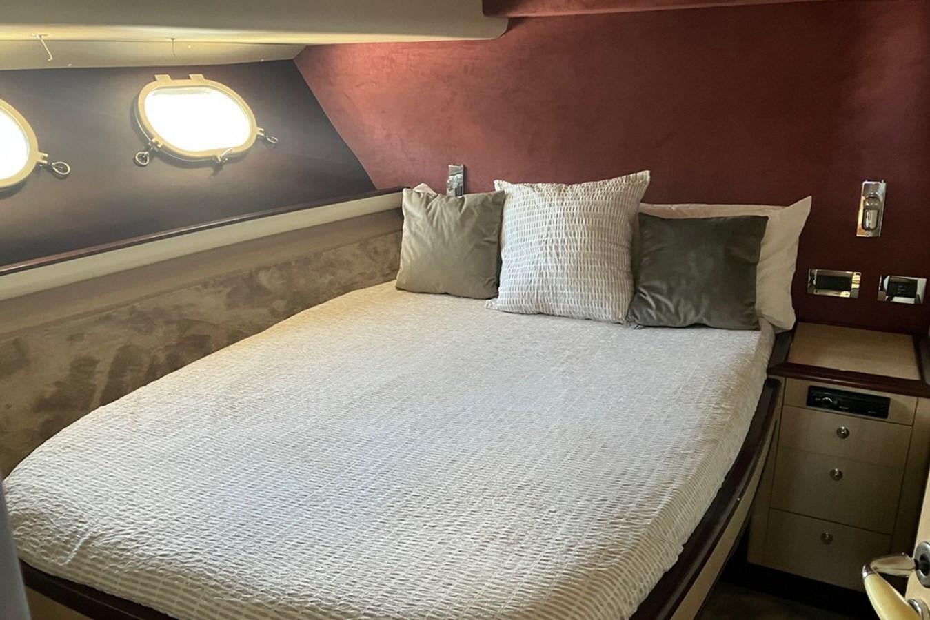 a bed with white sheets aboard VINTAGE Yacht for Sale