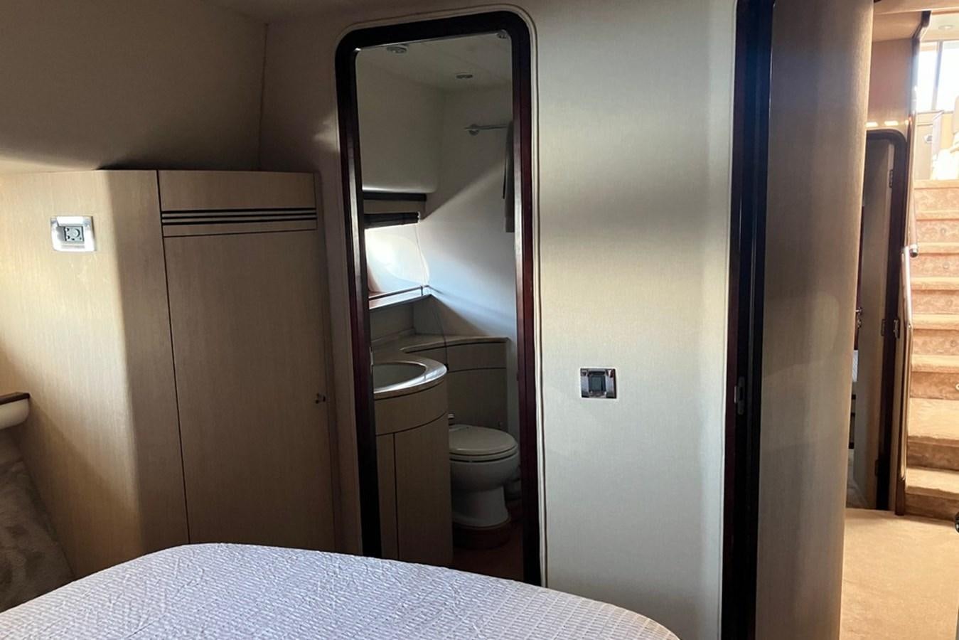 a bathroom with a white bed aboard VINTAGE Yacht for Sale