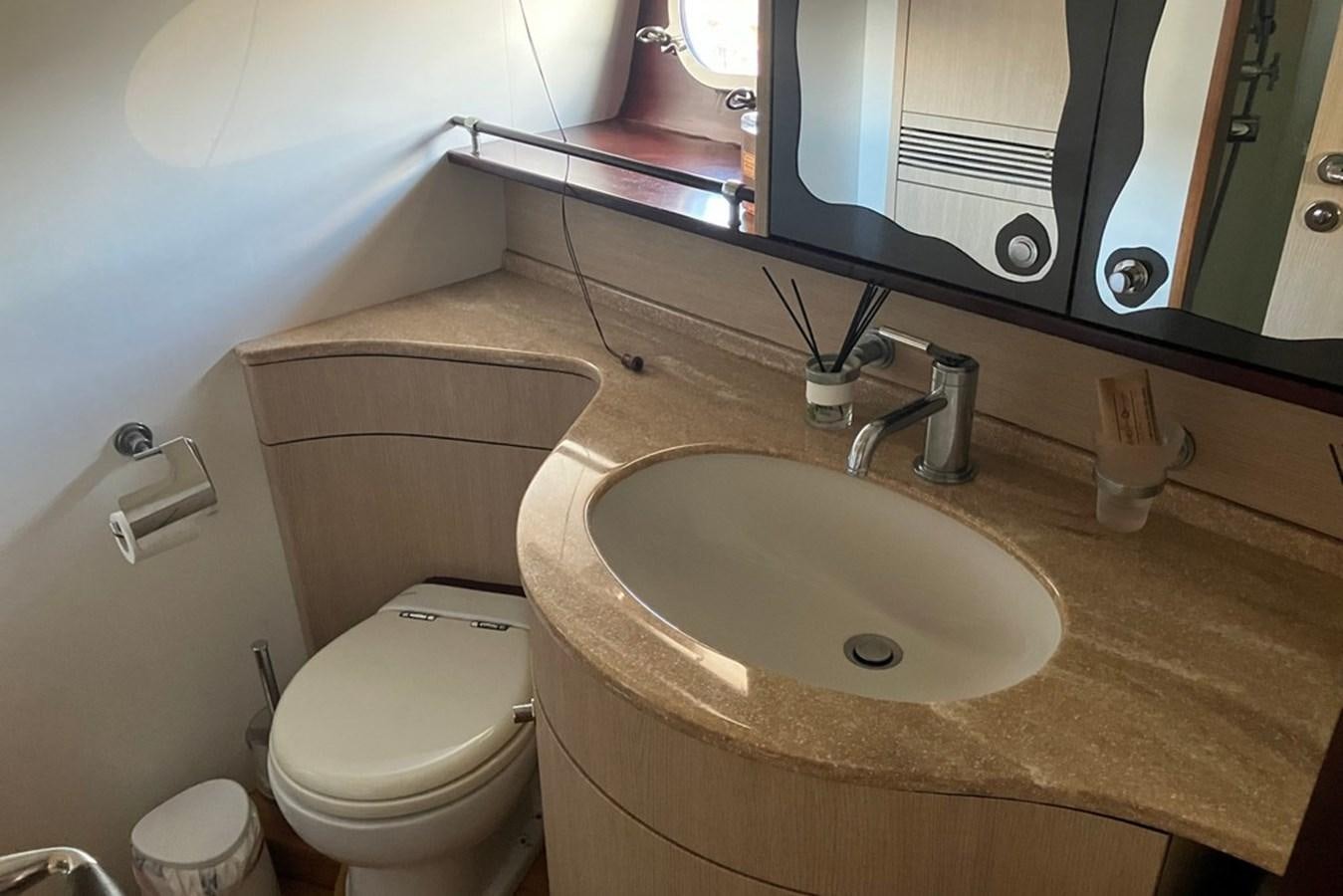 a bathroom with a sink and toilet aboard VINTAGE Yacht for Sale