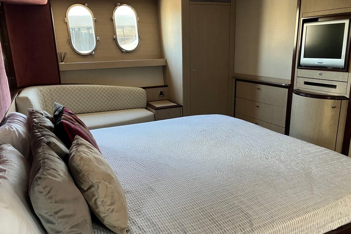a bed with a white sheet aboard VINTAGE Yacht for Sale