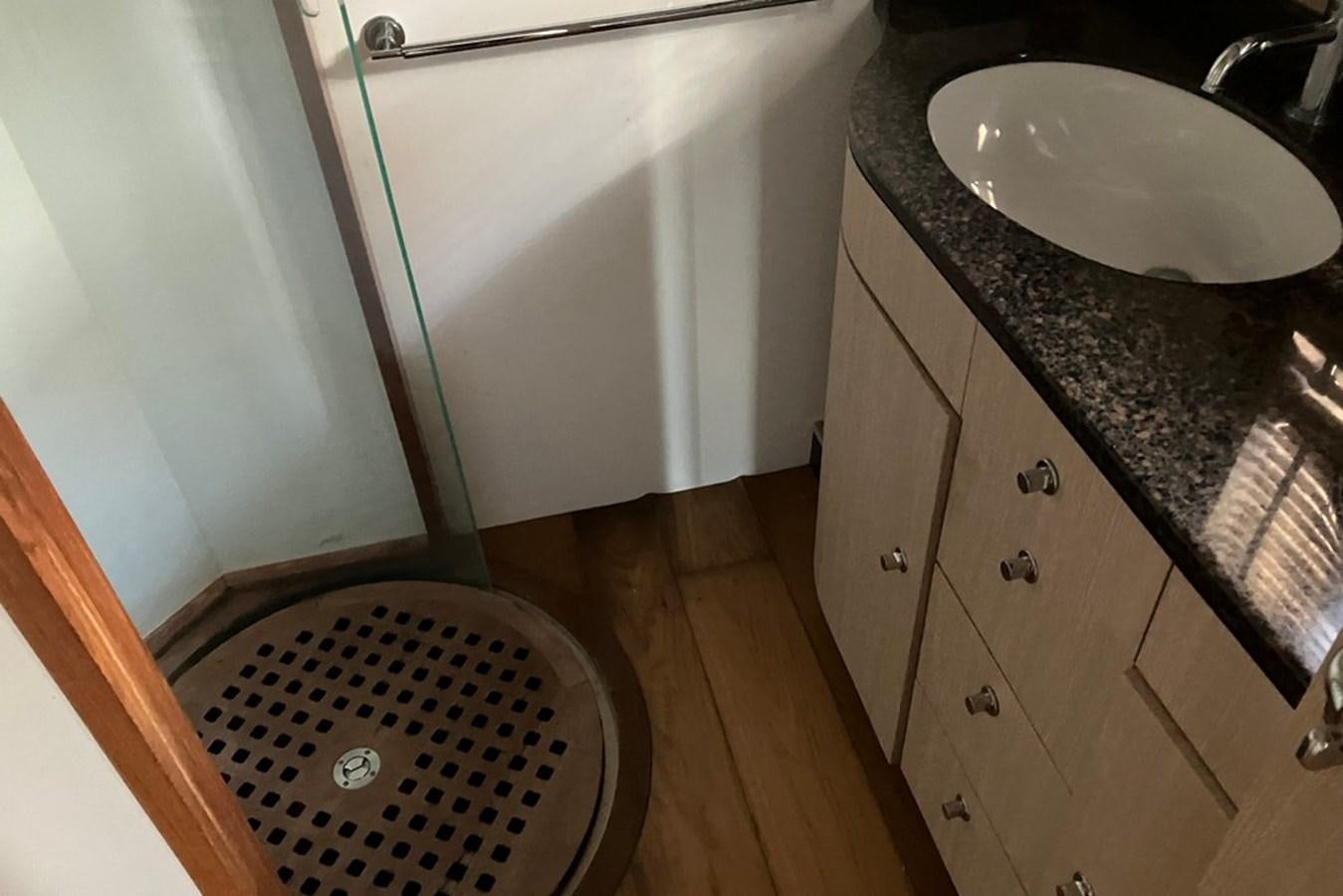 a sink and a dishwasher in a kitchen aboard VINTAGE Yacht for Sale