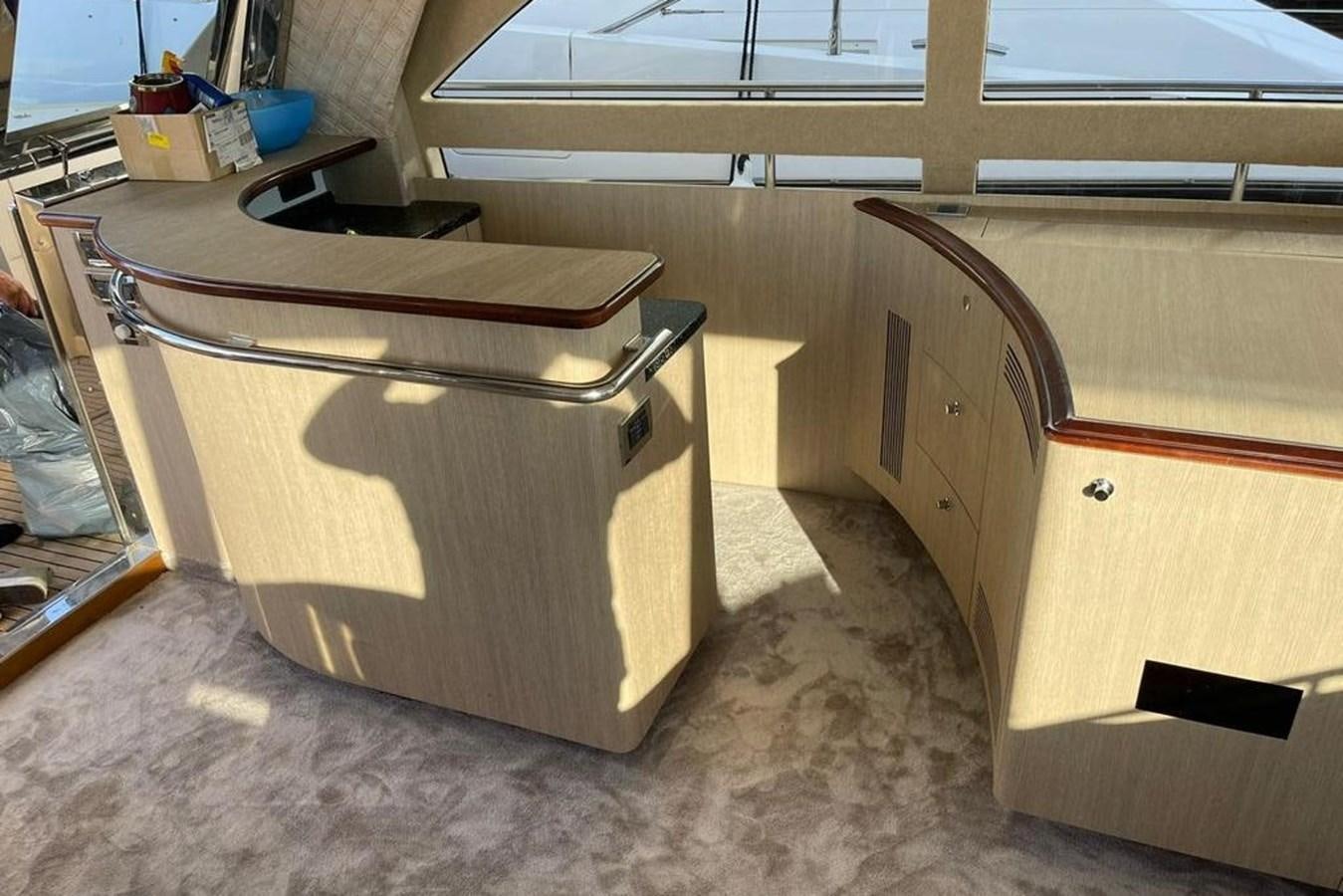a wooden cabinet with drawers aboard VINTAGE Yacht for Sale