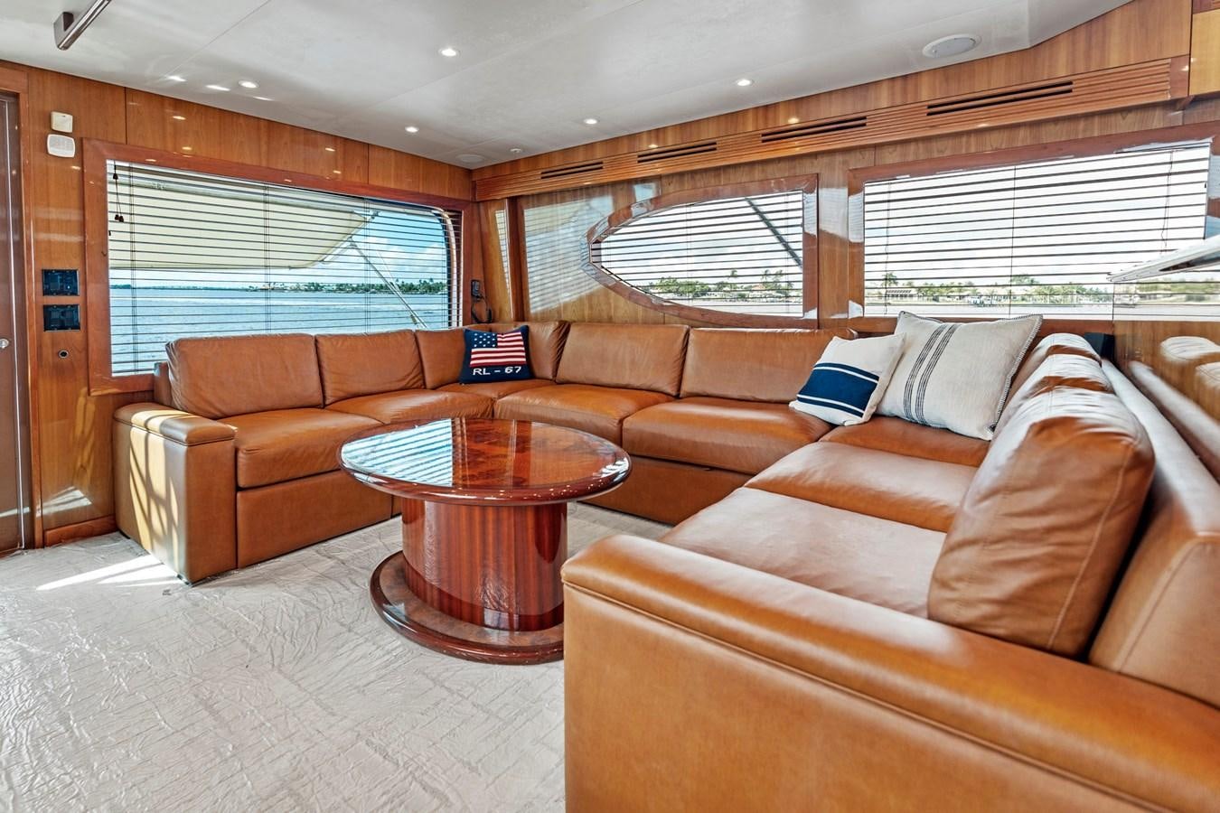 a living room with a couch and a coffee table aboard NAUTICAL NOMAD Yacht for Sale