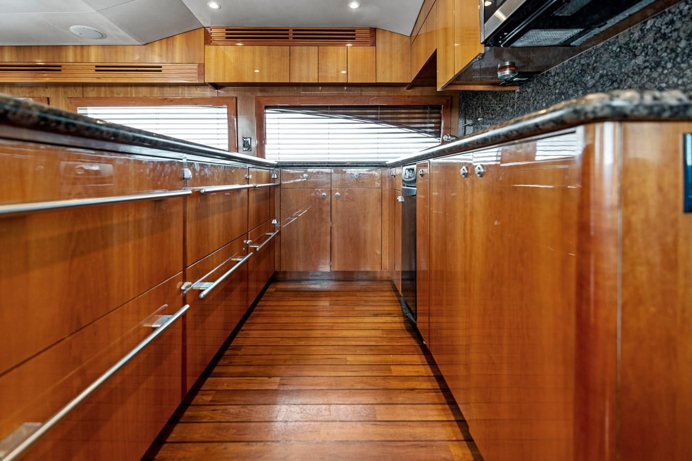 a room with wooden cabinets aboard NAUTICAL NOMAD Yacht for Sale