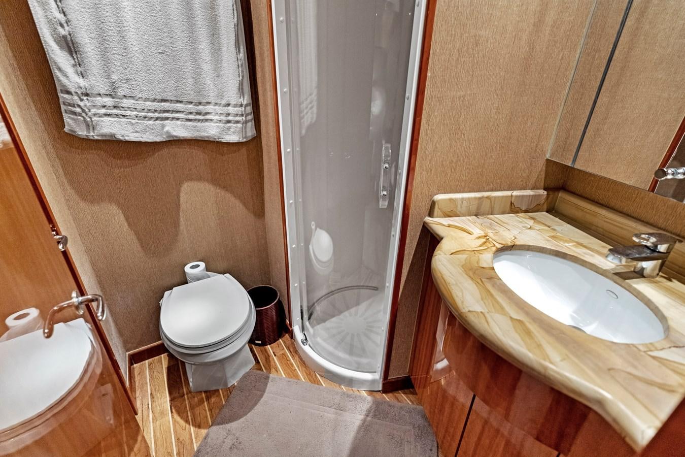 a bathroom with a sink and toilet aboard NAUTICAL NOMAD Yacht for Sale