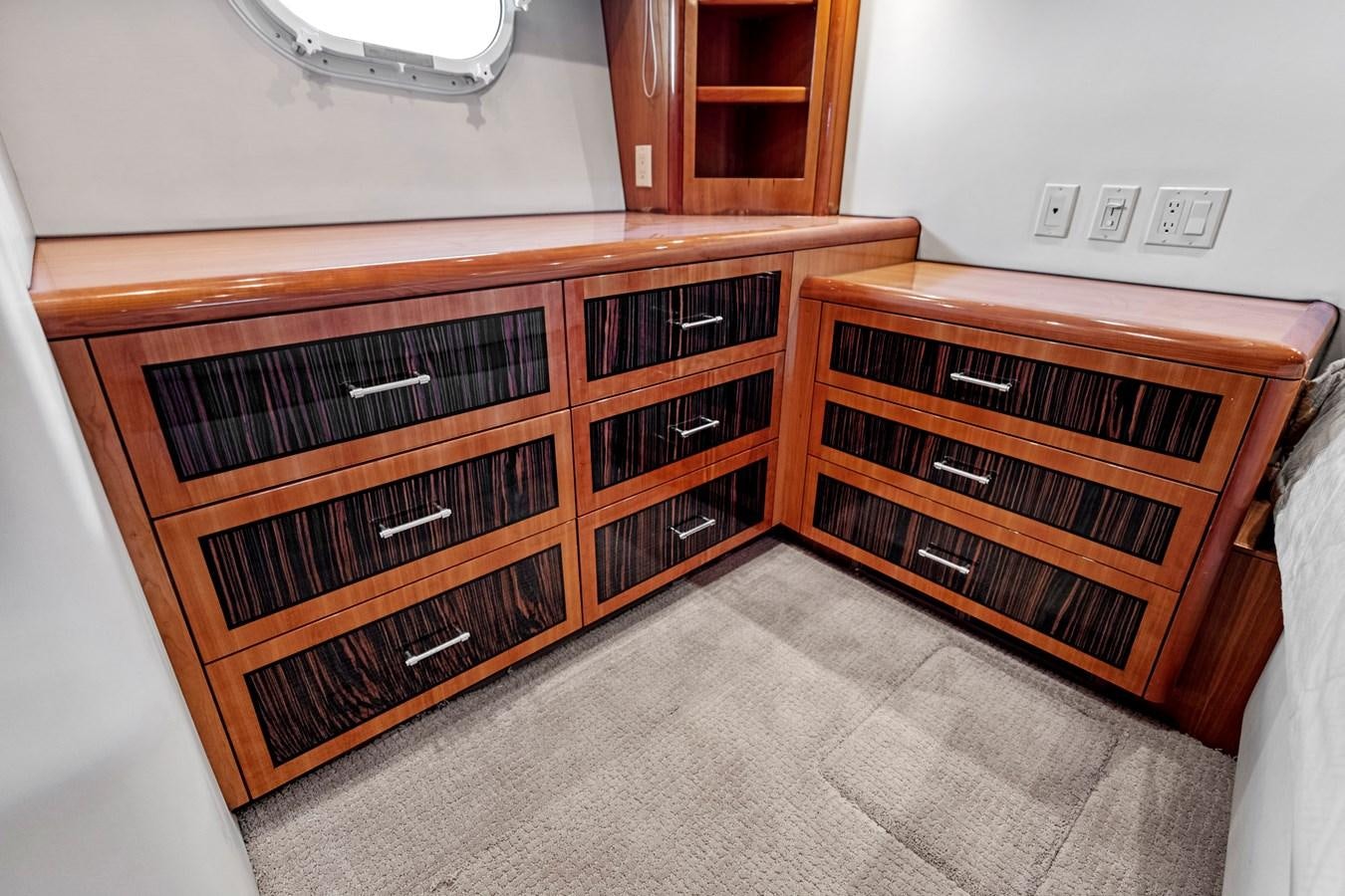 a kitchen with wooden cabinets aboard NAUTICAL NOMAD Yacht for Sale