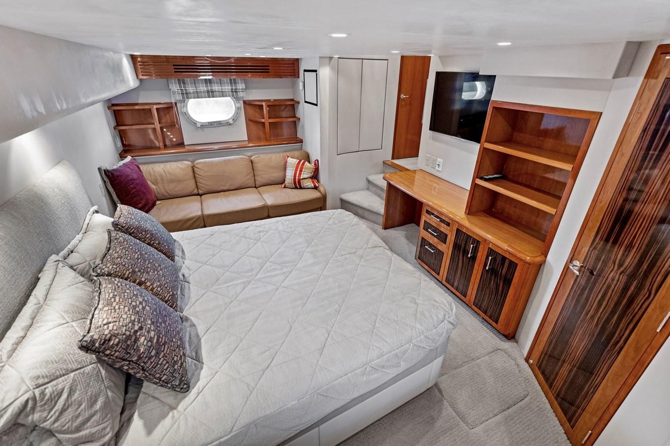 a living room with a bed and a couch aboard NAUTICAL NOMAD Yacht for Sale