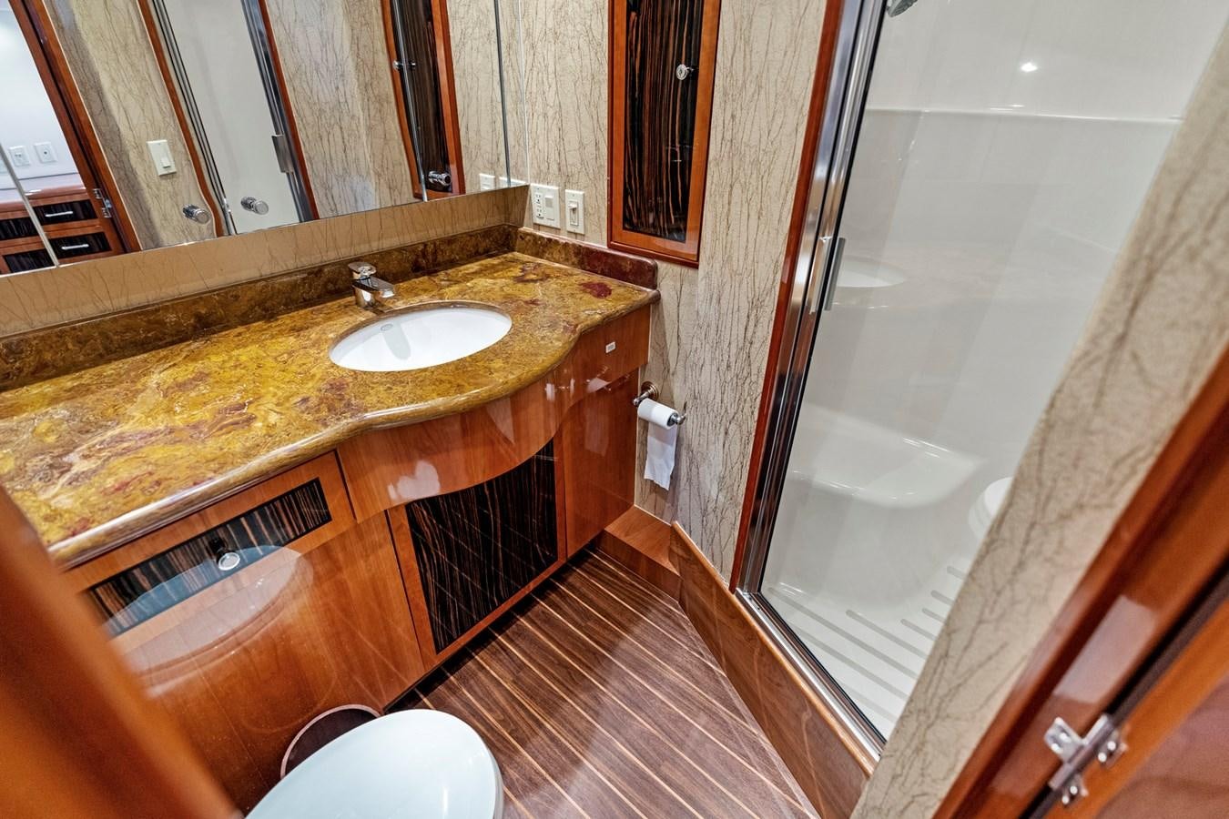 a bathroom with a countertop sink and a shower aboard NAUTICAL NOMAD Yacht for Sale