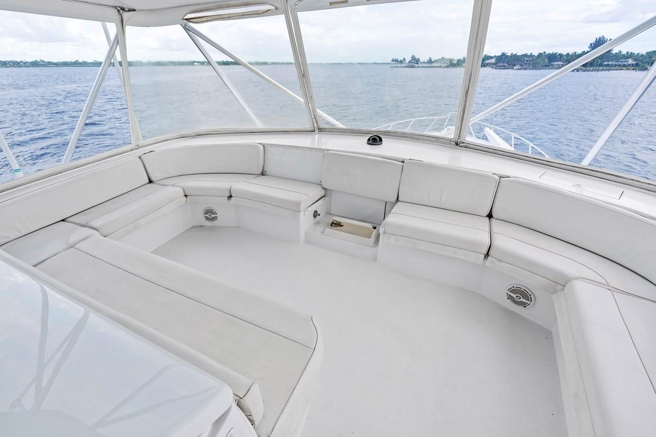 a white boat with a white sail aboard NAUTICAL NOMAD Yacht for Sale