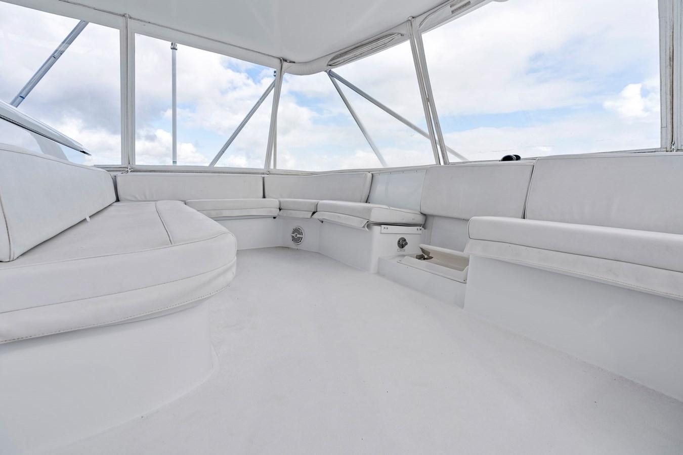 a room with white seats aboard NAUTICAL NOMAD Yacht for Sale