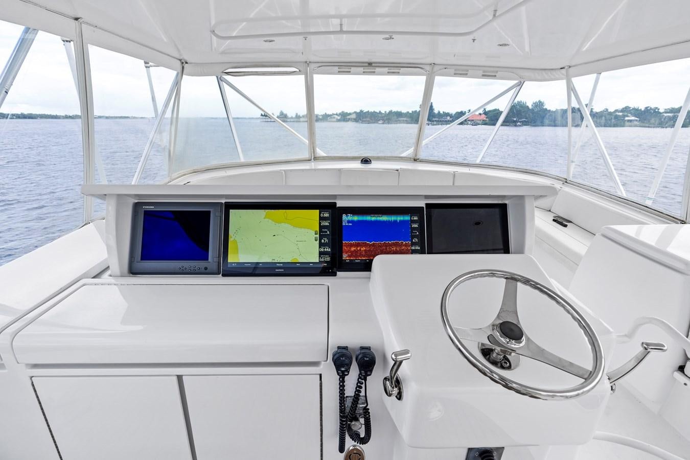 a white vehicle with a large screen aboard NAUTICAL NOMAD Yacht for Sale