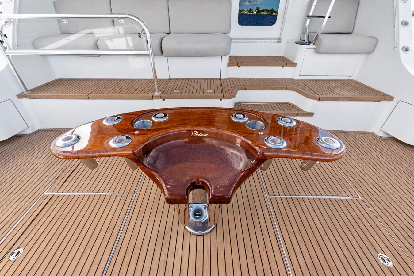 a red skateboard on a wooden surface aboard NAUTICAL NOMAD Yacht for Sale