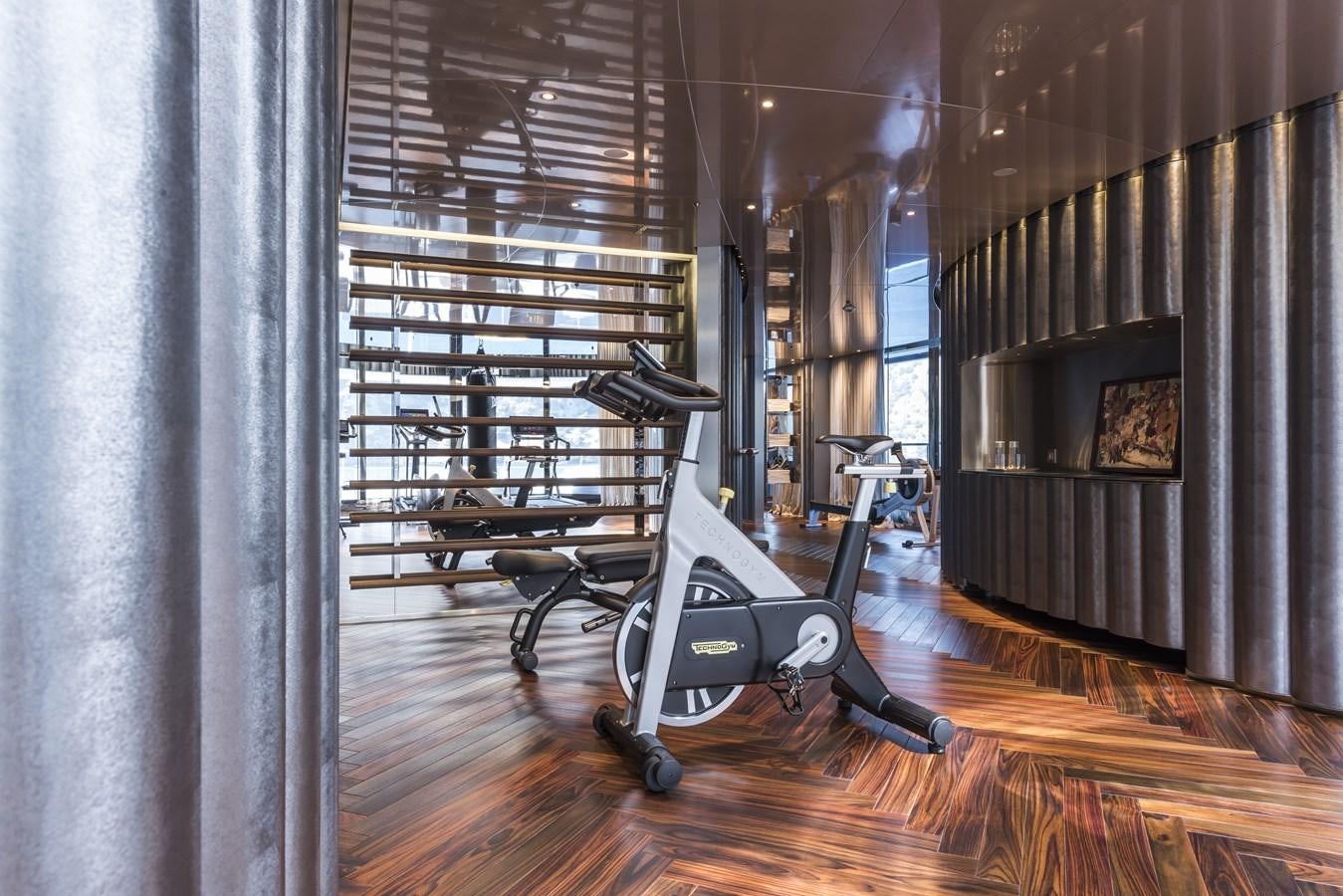 a room with a large mirror and a bench aboard SAVANNAH Yacht for Sale