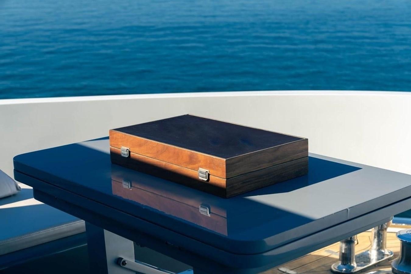a rectangular black object on a white surface next to a body of water aboard ARCADIA 85 2015 Yacht for Sale