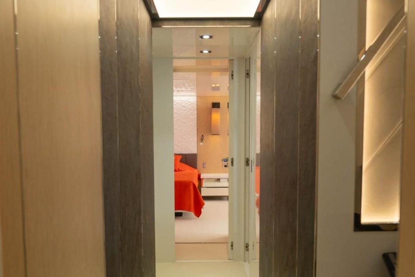 a hallway with a chair aboard ARCADIA 85 2015 Yacht for Sale