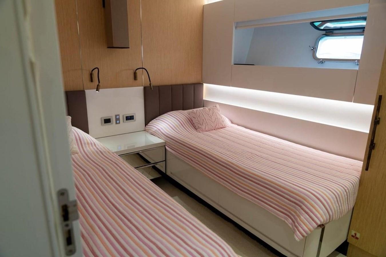 a couple of beds in a room aboard ARCADIA 85 2015 Yacht for Sale