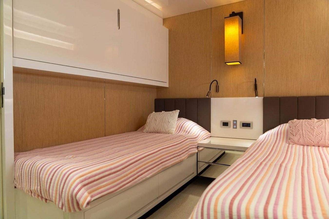 a couple of beds in a room aboard ARCADIA 85 2015 Yacht for Sale