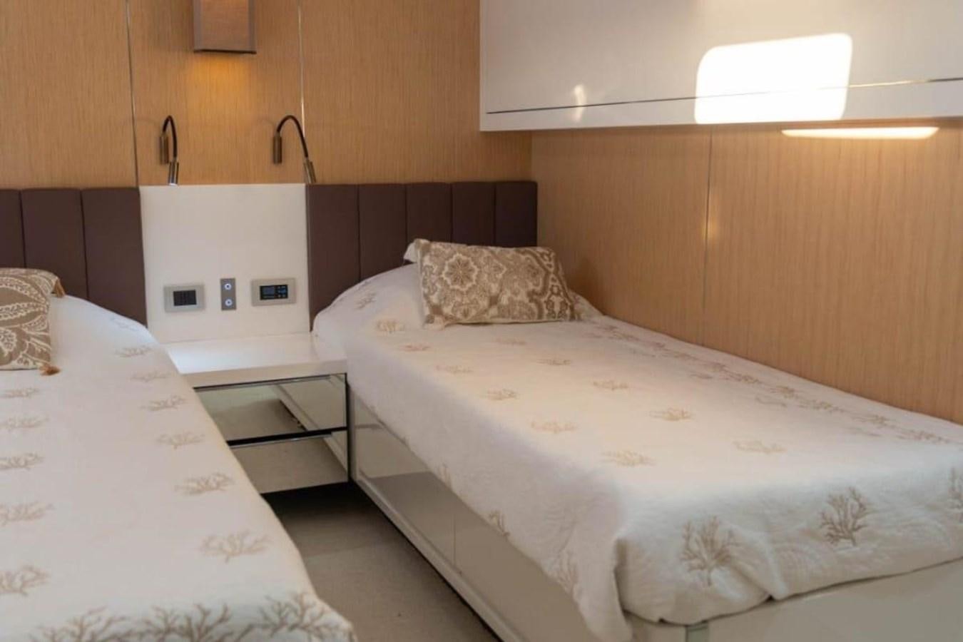 a couple of beds in a room aboard ARCADIA 85 2015 Yacht for Sale