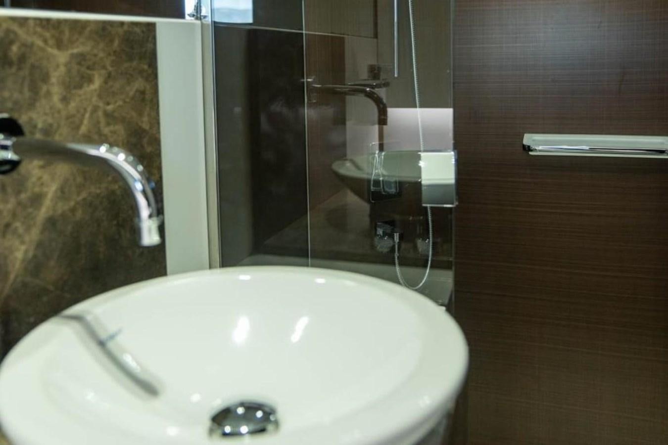 a sink and faucet in a bathroom aboard ARCADIA 85 2015 Yacht for Sale