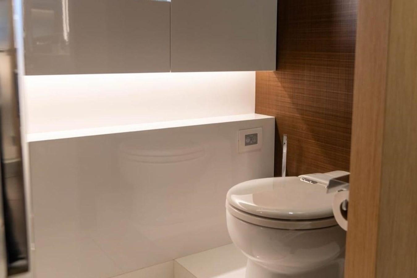 a toilet in a bathroom aboard ARCADIA 85 2015 Yacht for Sale