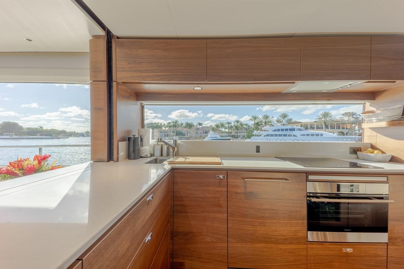 a kitchen with wooden cabinets aboard ESCAPEMENT Yacht for Sale