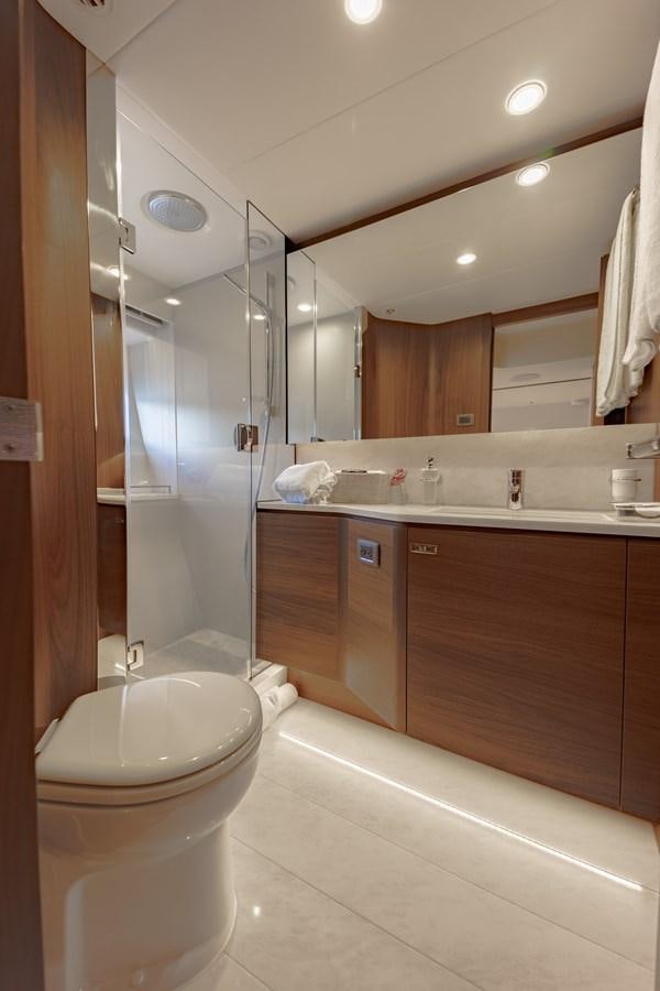 a bathroom with a toilet and a sink aboard ESCAPEMENT Yacht for Sale