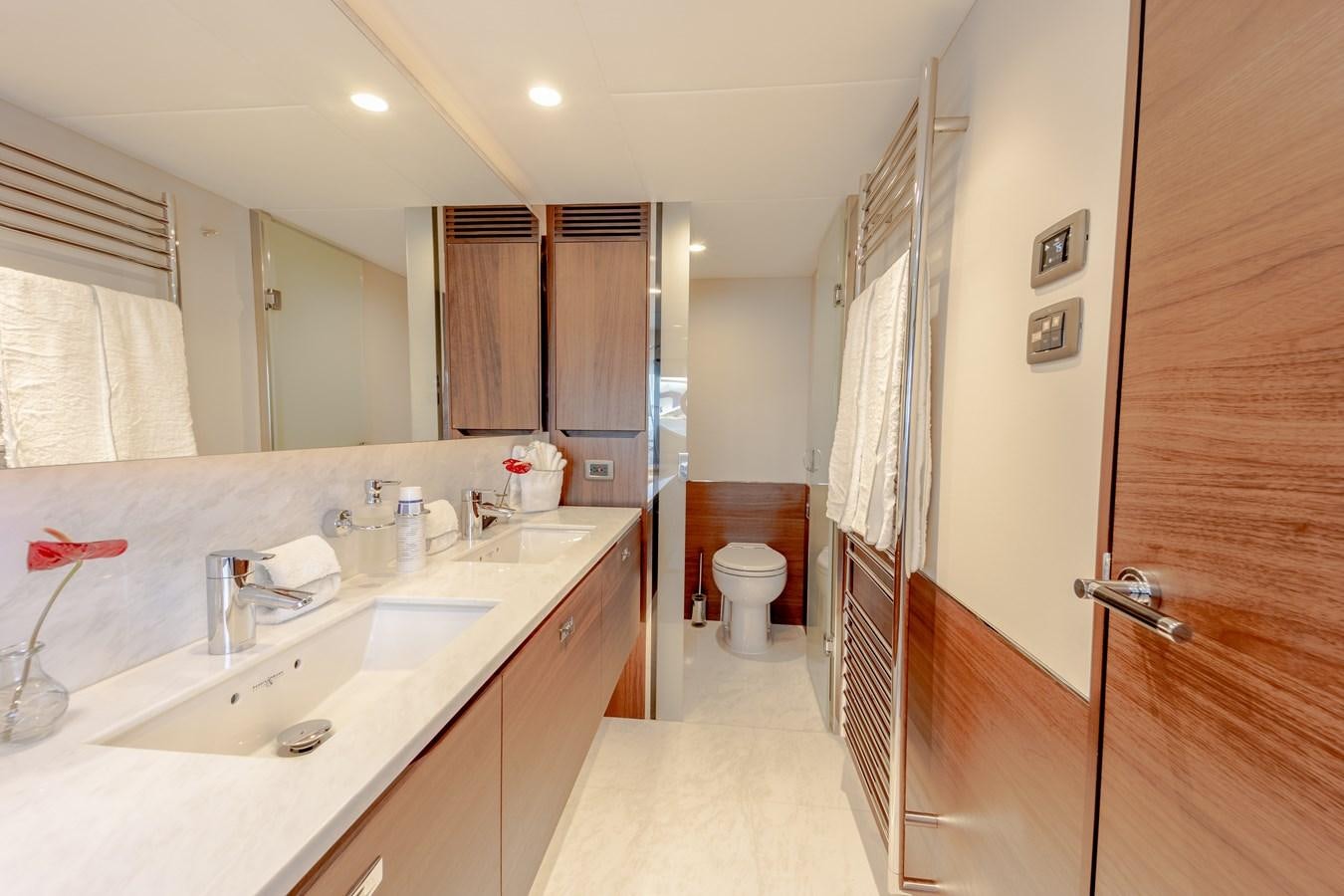 a bathroom with a sink and a toilet aboard ESCAPEMENT Yacht for Sale