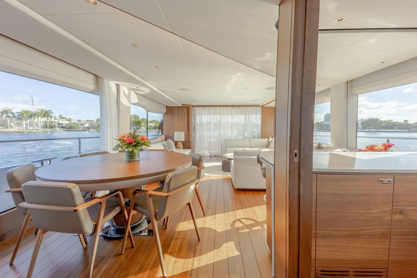 a room with a table and chairs aboard ESCAPEMENT Yacht for Sale