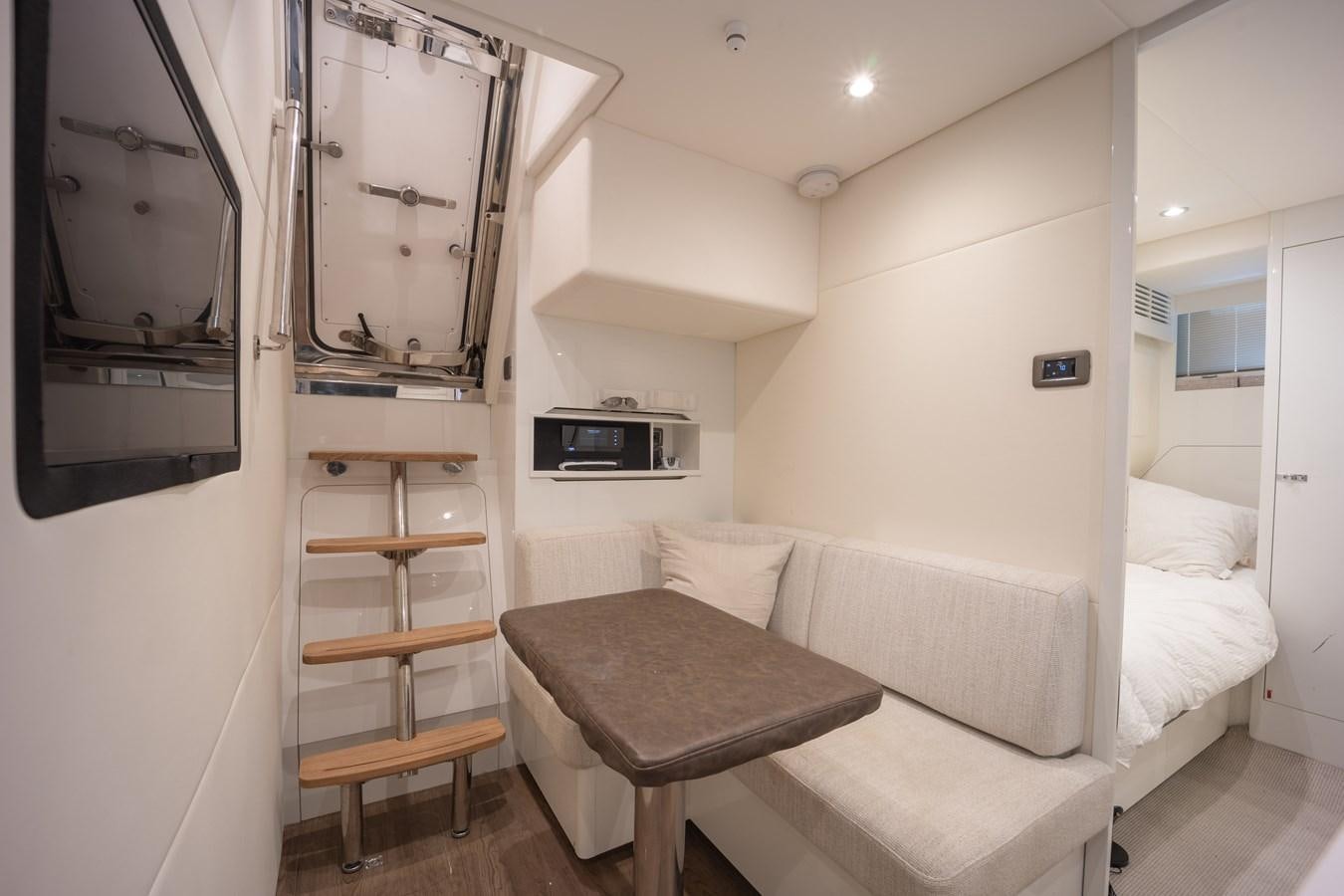 a room with a bed and a tv aboard ESCAPEMENT Yacht for Sale