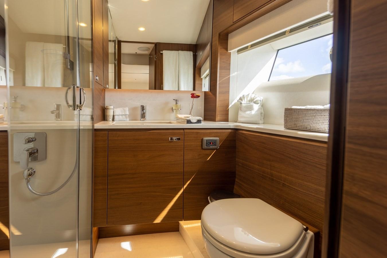 a bathroom with a glass shower aboard ESCAPEMENT Yacht for Sale